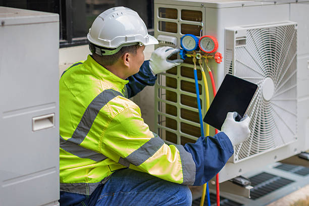 Professional Hvac technician working in Vernon, AL
